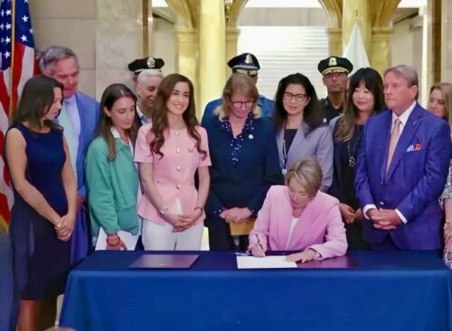On 7/24/2026, District AttoDA Shugrue attends the signing of the 